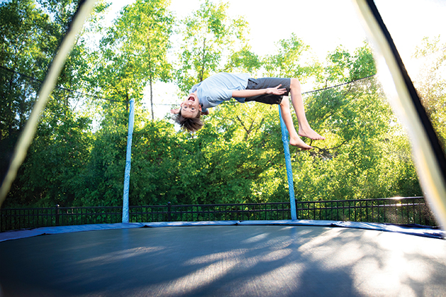Child flipping on trampoline