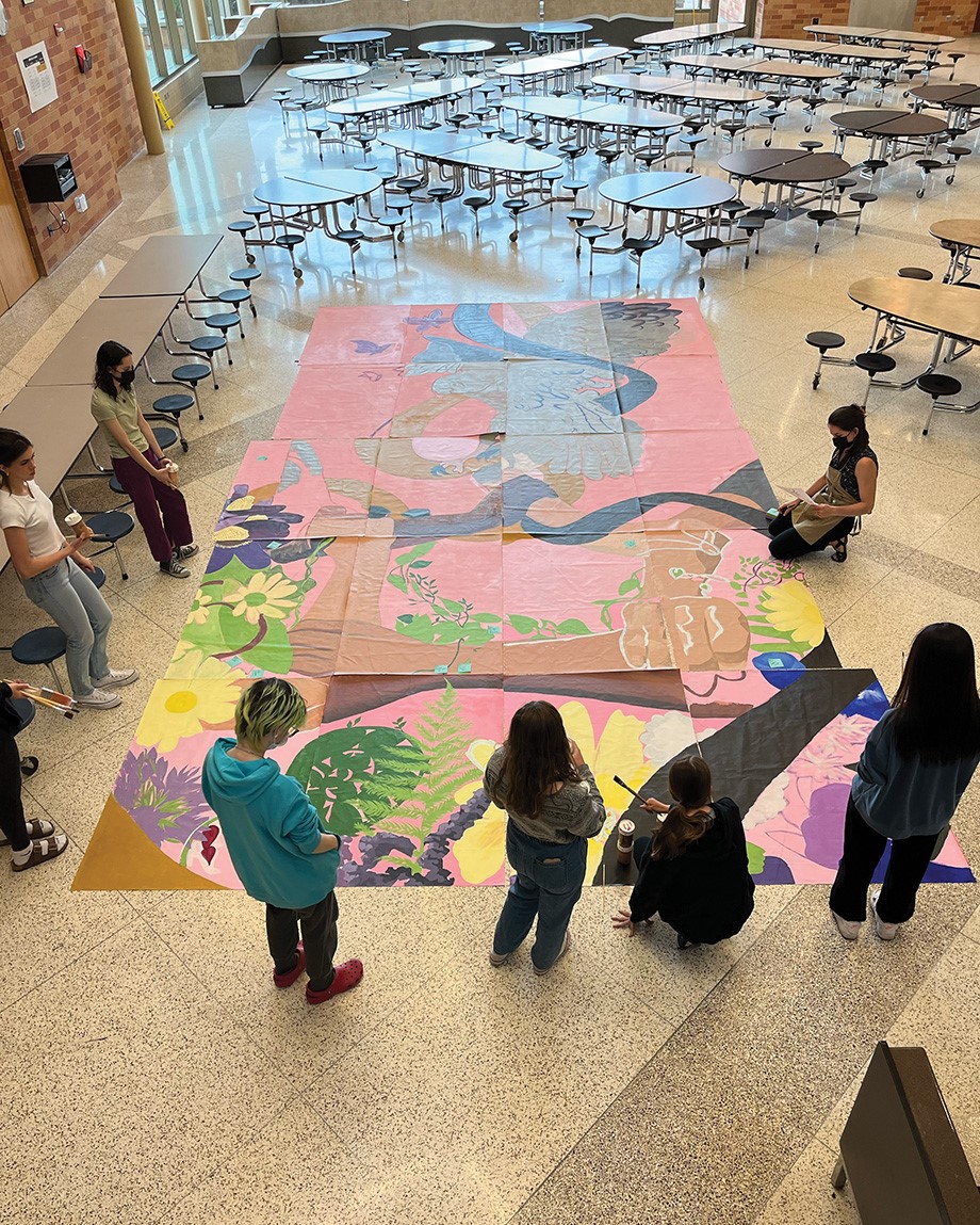 ERHS art students determining and refining layout of mural panels in progress.