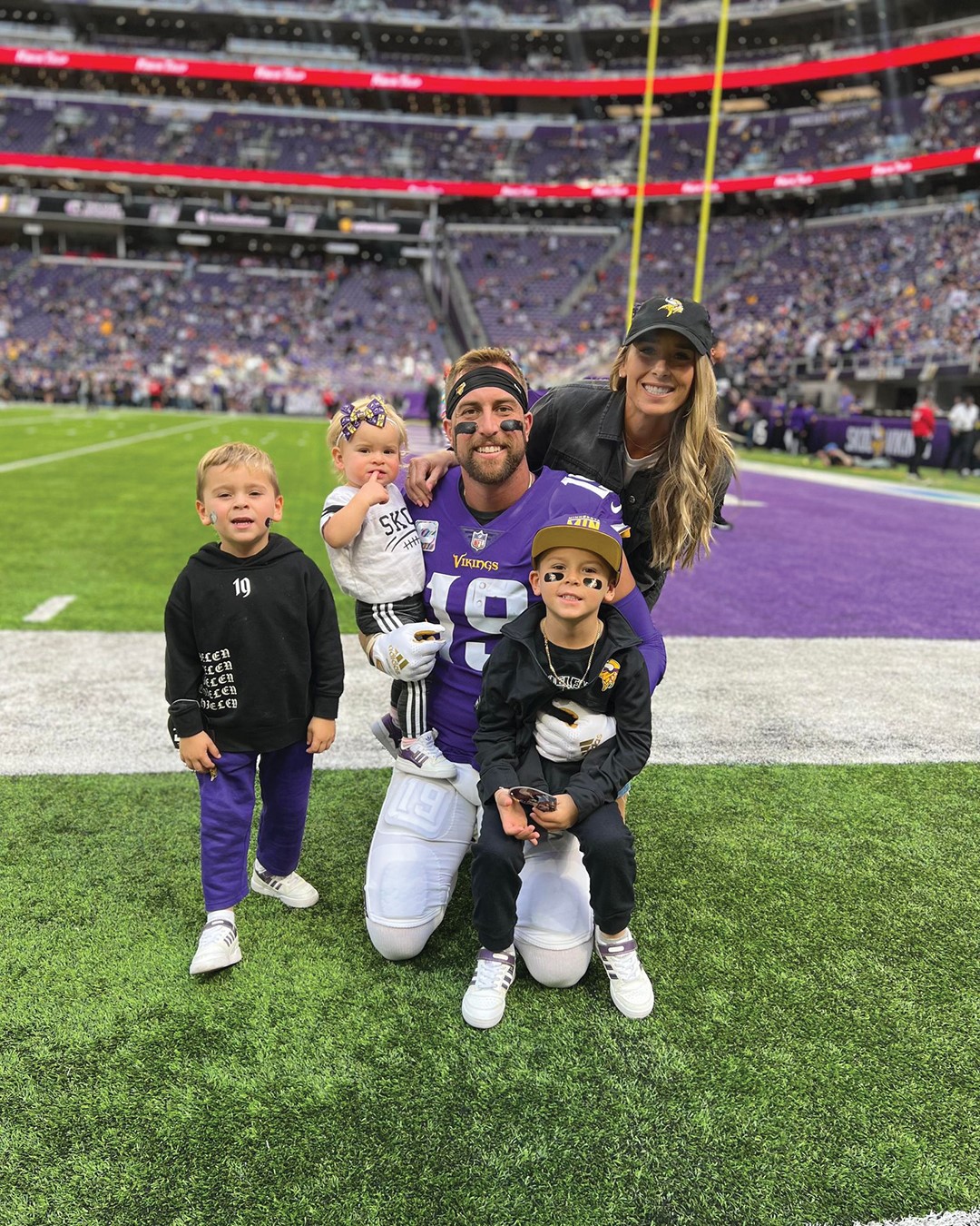 Caitlin Thielen and her children, Hudson, Cora and Asher, support husband and father Adam Thielen on the field.