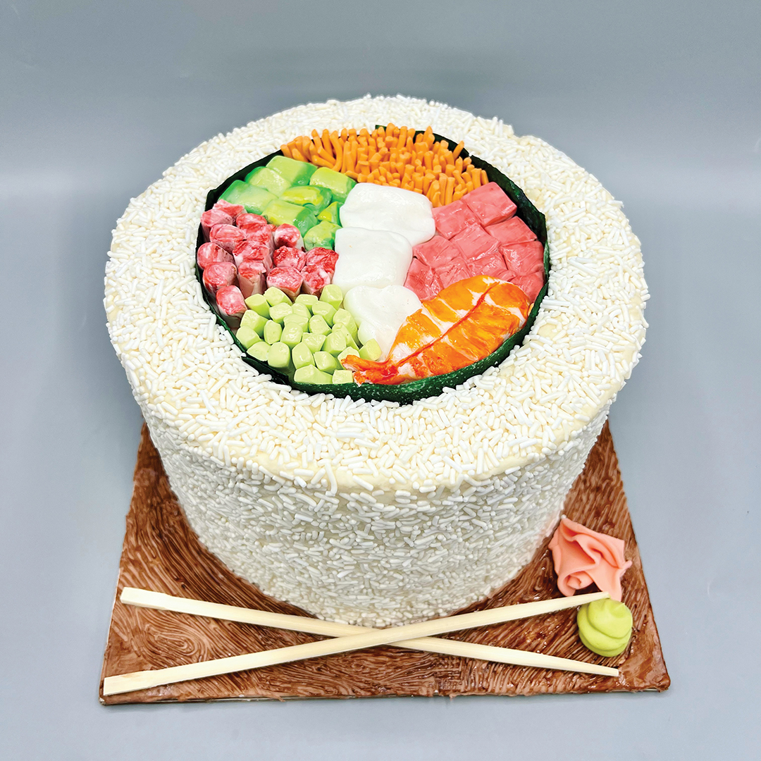 Cake decorated to look like a sushi roll.
