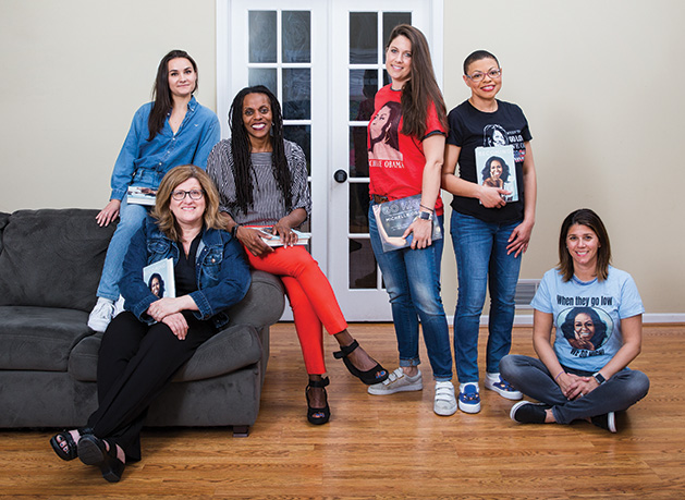 Sheletta Brundidge of the Two Haute Mamas WCCO Radio podcast poses with her book club, who read Michelle Obama's "Becoming"