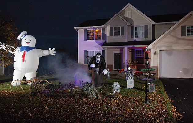 John Soma's Halloween yard display, featuring a graveyard, inflatable Stay Pufy Marshmallow Man and more.