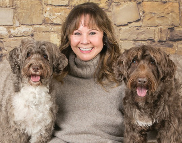 Super Pet Parent Donna Chicone with her two Portuguese water dogs