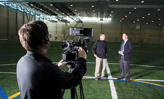 SWCTC's Bob McSherry shoots footage of Dave Black and Jason Egerstrom at Bielenberg Sports Center.