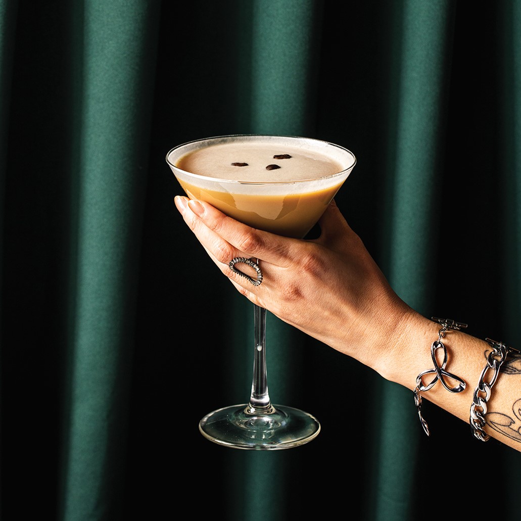 Hand Holding an Espresso Martini