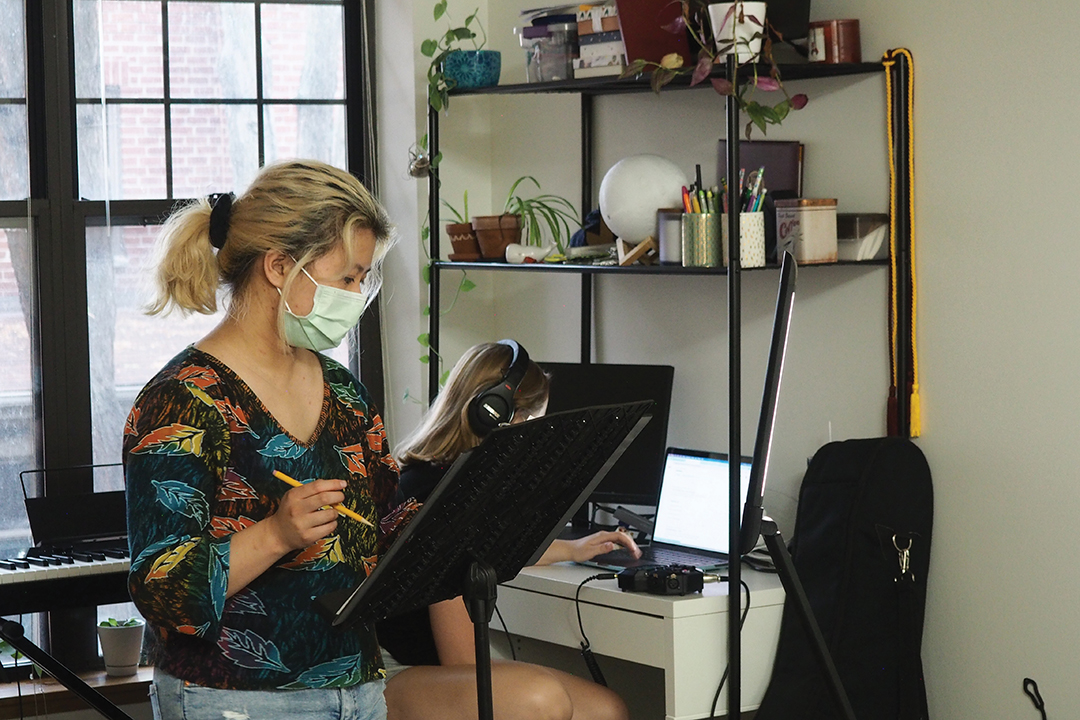 Two of Picnic Basket Theatre’s co-founders, Emma Lai and Rachel Brees, recording Somewhere Over the Pacific in 2021.