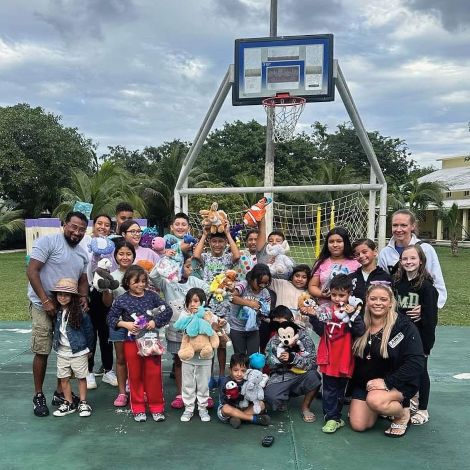 Sara and Esteban Carachuri gifting toys to children in Cozumel, Mexico, in December 2023.