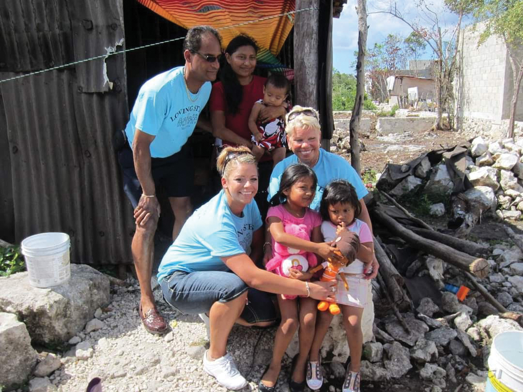 Sara Carachuri (bottom left) and Shari Hanson (bottom right) gifting shoes to children in Cozumel. 