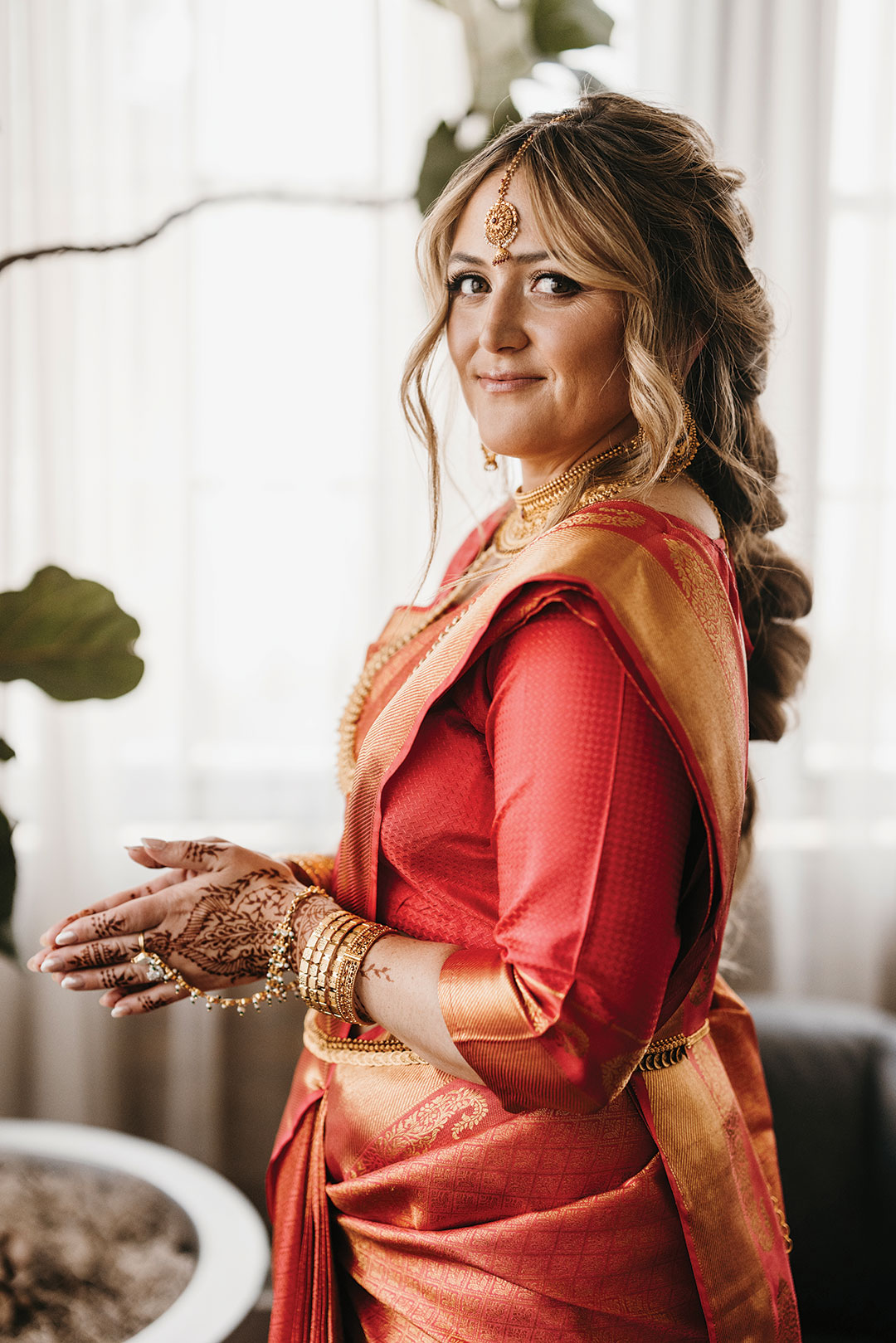 Nan in a red lehenga