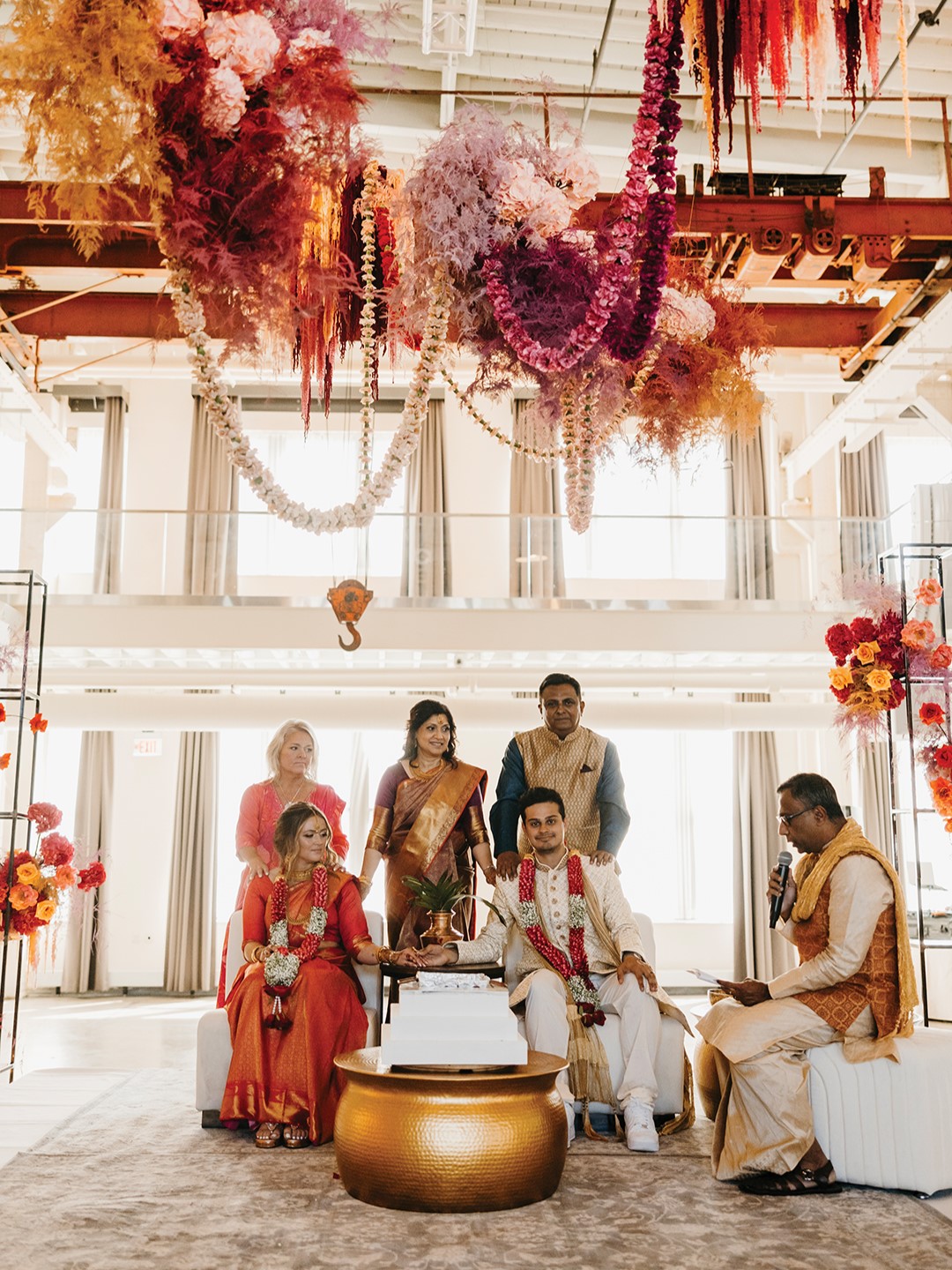 For the ceremony, Nan Sen stunned in a pink and gold saree with intricate gold jewelry gifted from the groom’s family. Rishi Sen kept it classic with an off-white kurta, featuring gold accents and added a touch of playfulness by pairing his outfit with white Nike Air Force 1 shoes—a nod to his personal style and a practical choice for the dance floor.