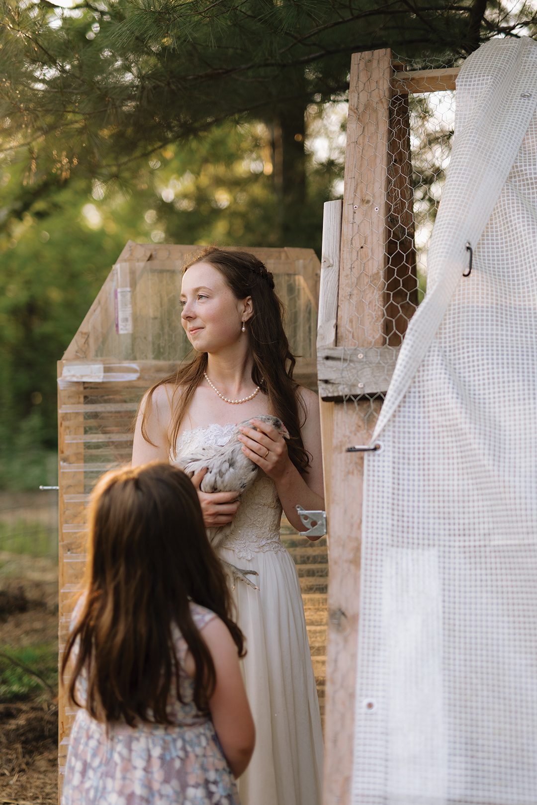 The bride’s remade vintage dress was purchased and altered at Sienna Cole Bridal. Owner Lisa Ramlet replaced the original skirt with a flowy, organic fabric. The look was balanced with her great-grandmother’s pearl jewelry, secondhand clogs and a blusher veil (also from Sienna Cole).