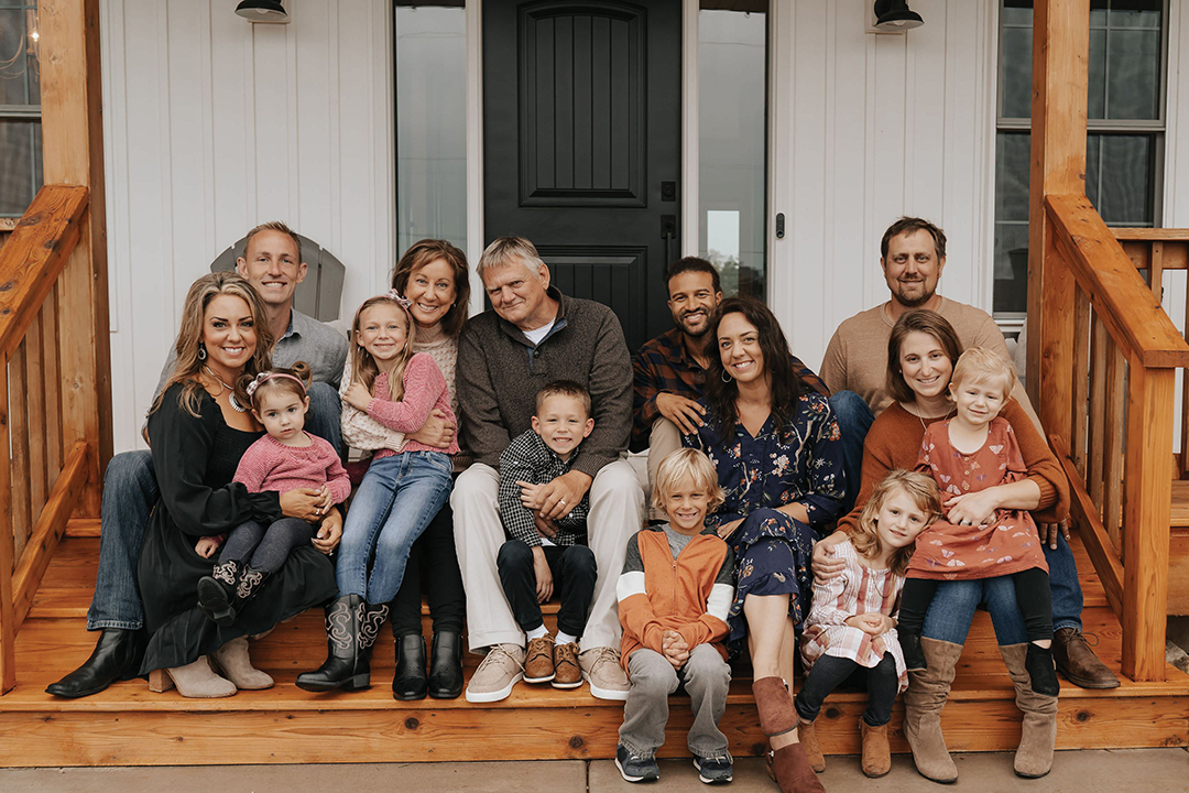 Alissa Staloch and her family, from left to right: Alissa, Rosalie, Joe, Sylvia, Sally, Terry (Alissa’s father and TBI survivor), Sullivan, Nolan, William, Amanda (Alissa’s twin sister and TBI survivor), Nora, Izzy, Sarah and Chad. 