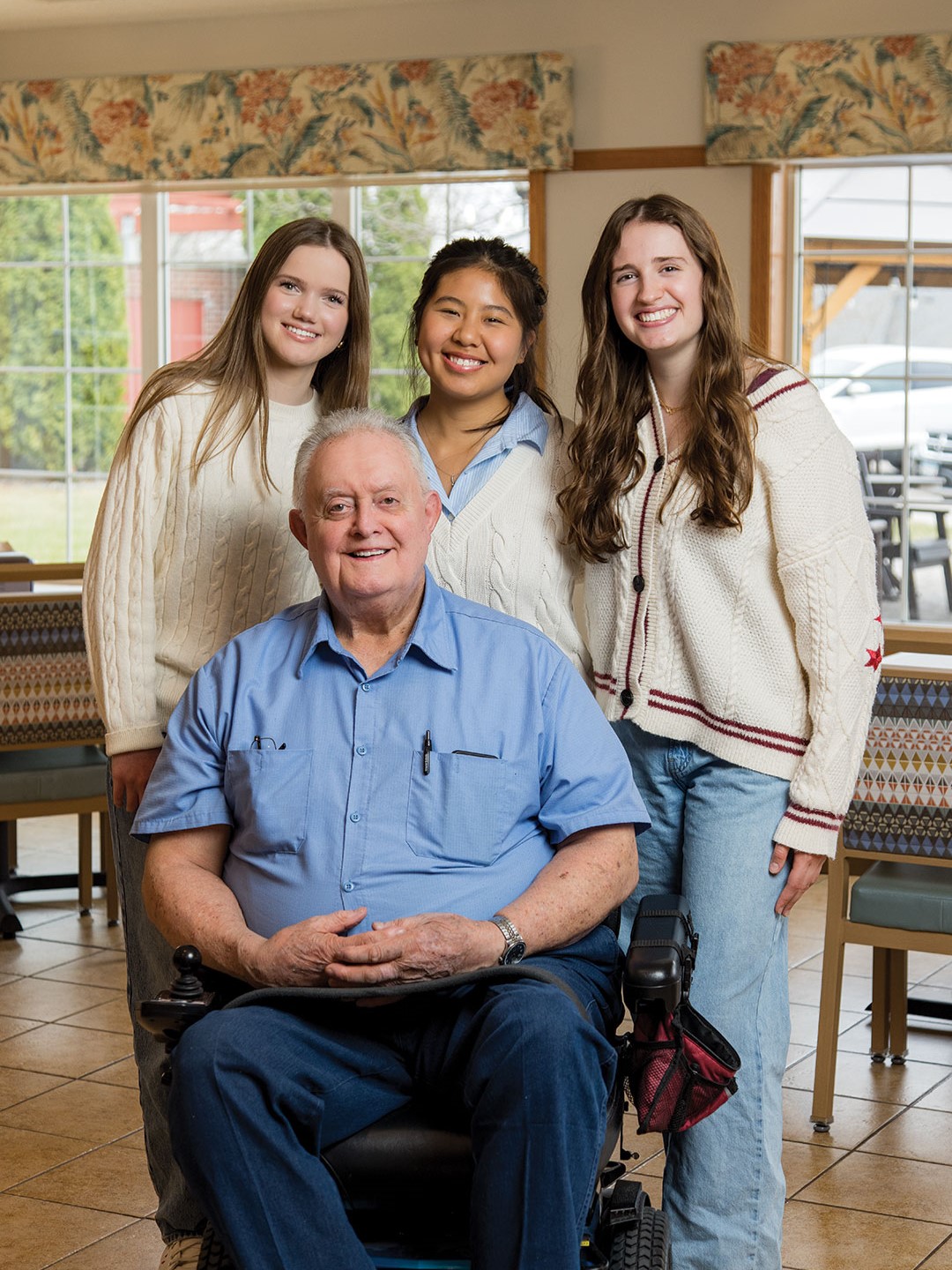  Mirella Janssen, Emily Zhou and Eliza Kubicek with Robert Wiese, a Stonecrest resident who acts as an ambassador for SavvySeniors.