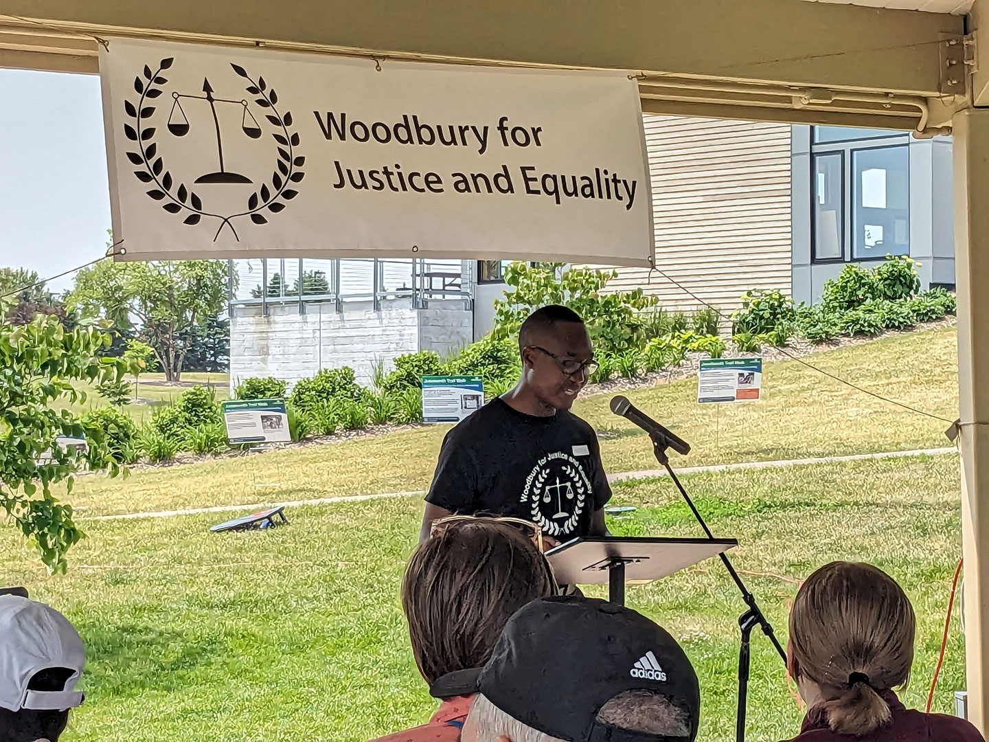 Walter Dobgima, founder of Woodbury for Justice and Equality, addresses people gathered for the 2024 Juneteenth event at Ojibway Park.