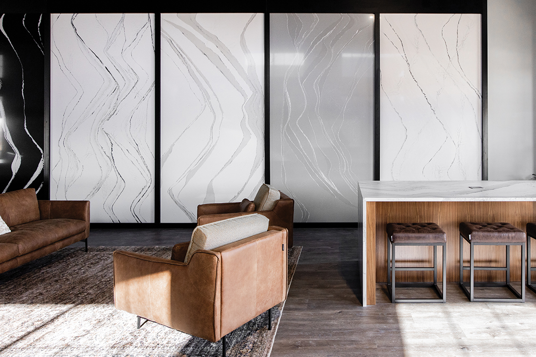 The gallery wall at Select Surfaces in Woodbury showcases full quartz slab designs, elegantly displayed to inspire customers with their project selections.