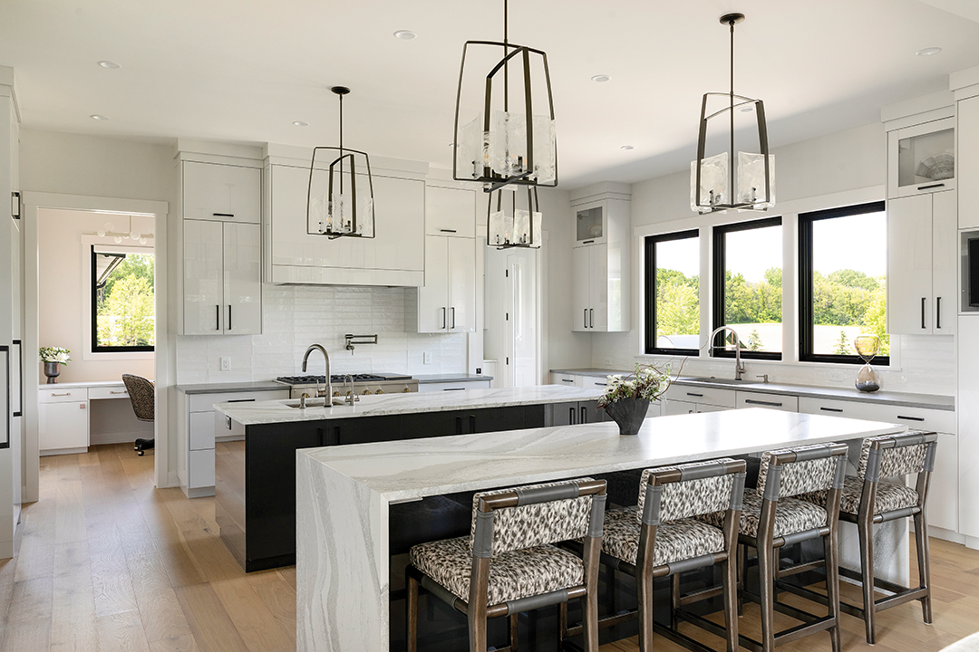The kitchen’s double island allows for easy hosting.