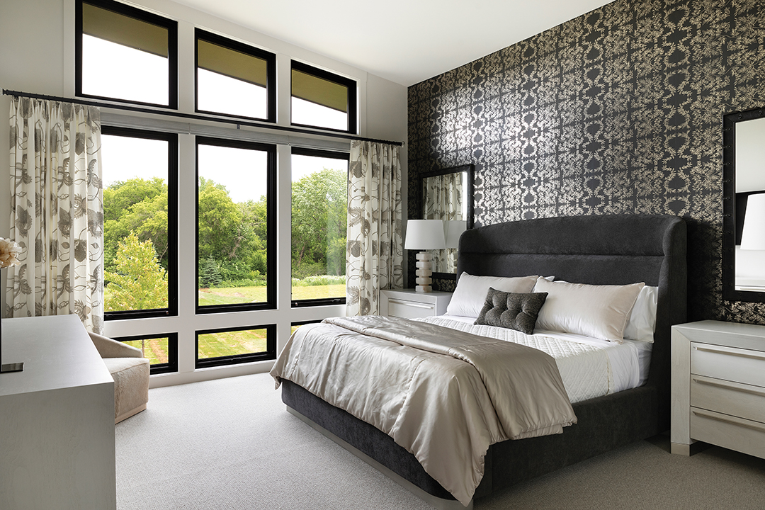 The primary suite includes his-and-hers closets and a spa-inspired bathroom.