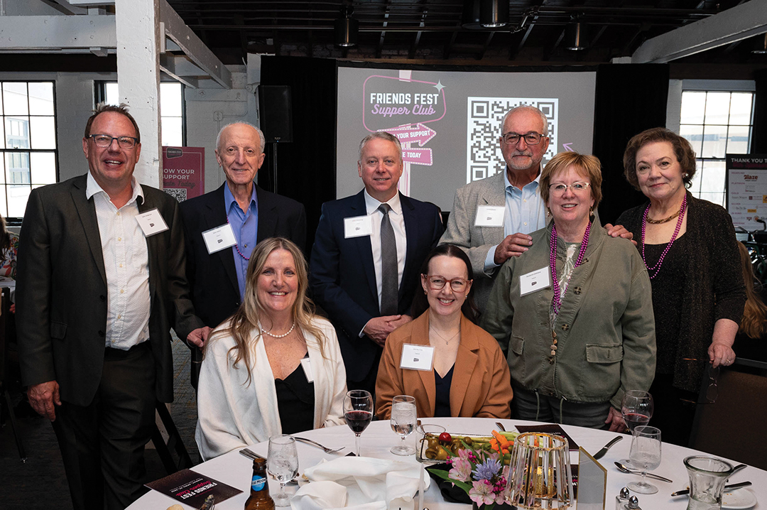 Attendees at Woodbury Friends Fest sitting at a table