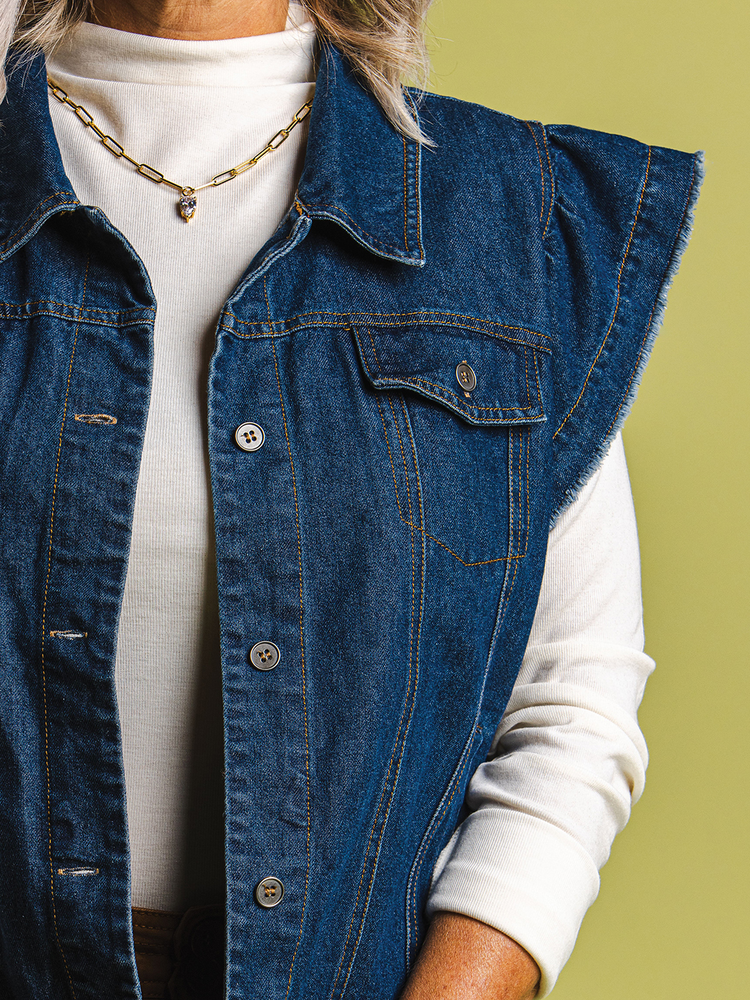 Channel the ’90s with the Mysteree knit mock neck long sleeve top ($48) paired with the Fate flutter sleeve denim jacket vest ($84). Top off the look with jewelry from No Whining, including its magnetic bracelet ($36) and JJ tear drop necklace ($56).