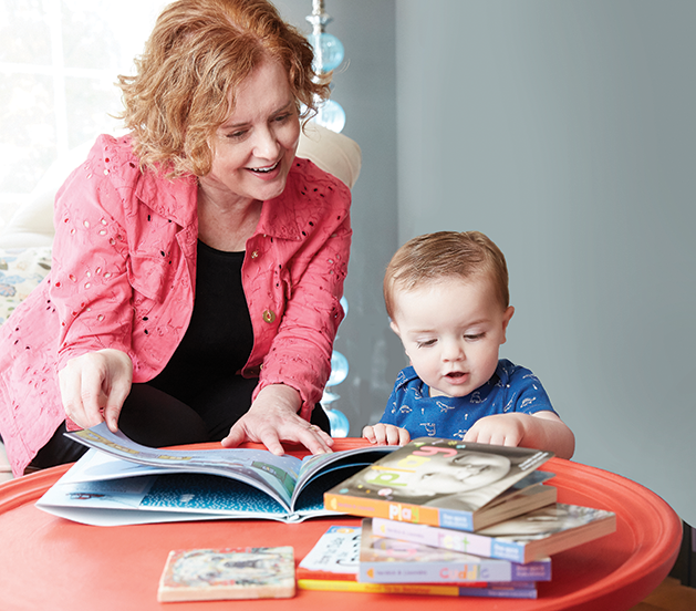 Elizabeth Verdick and her small friend Ari Pitterle read Small Walt together at Verdick's Woodbury home.