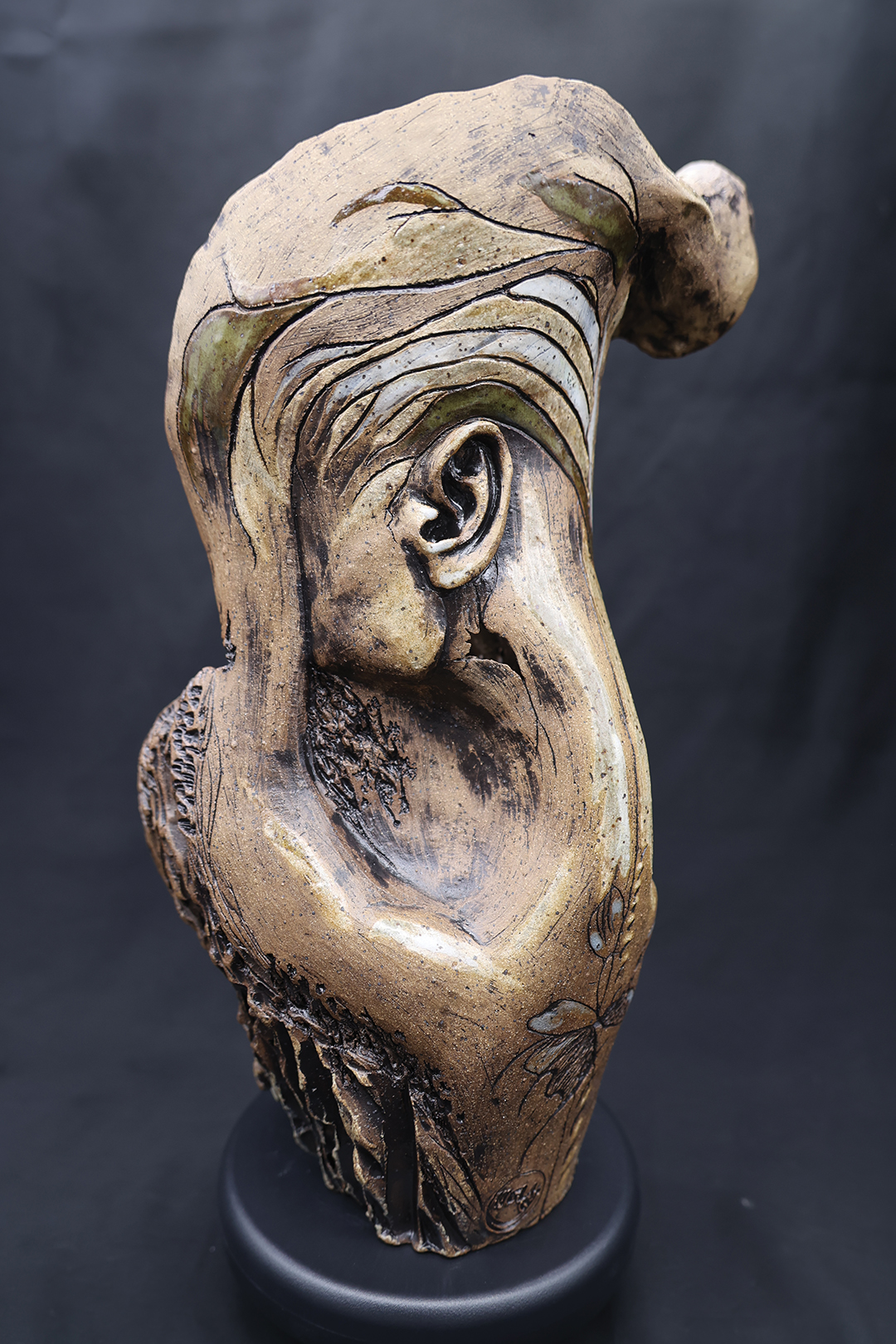 One of Melissa Wilcox’s untitled stoneware sculptures—standing 16 inches—blends organic forms with human anatomy, evoking the connection between body and nature. This sculpture has sold.