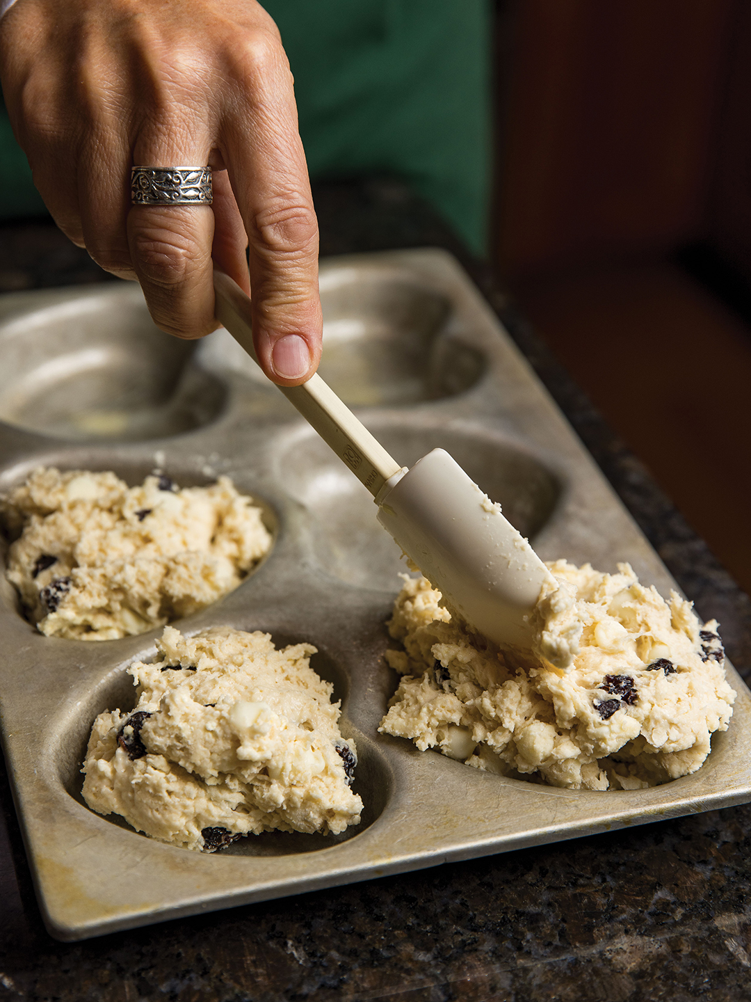 Kellie Stocker prepares her homemade Cranberry White Chocolate Scones.