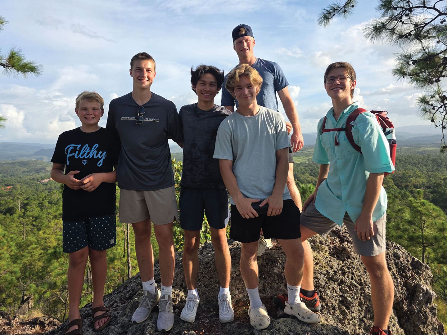 Min Ka and William Maguire, third and fourth from the left, are joined by other student volunteers on a hike in Honduras.