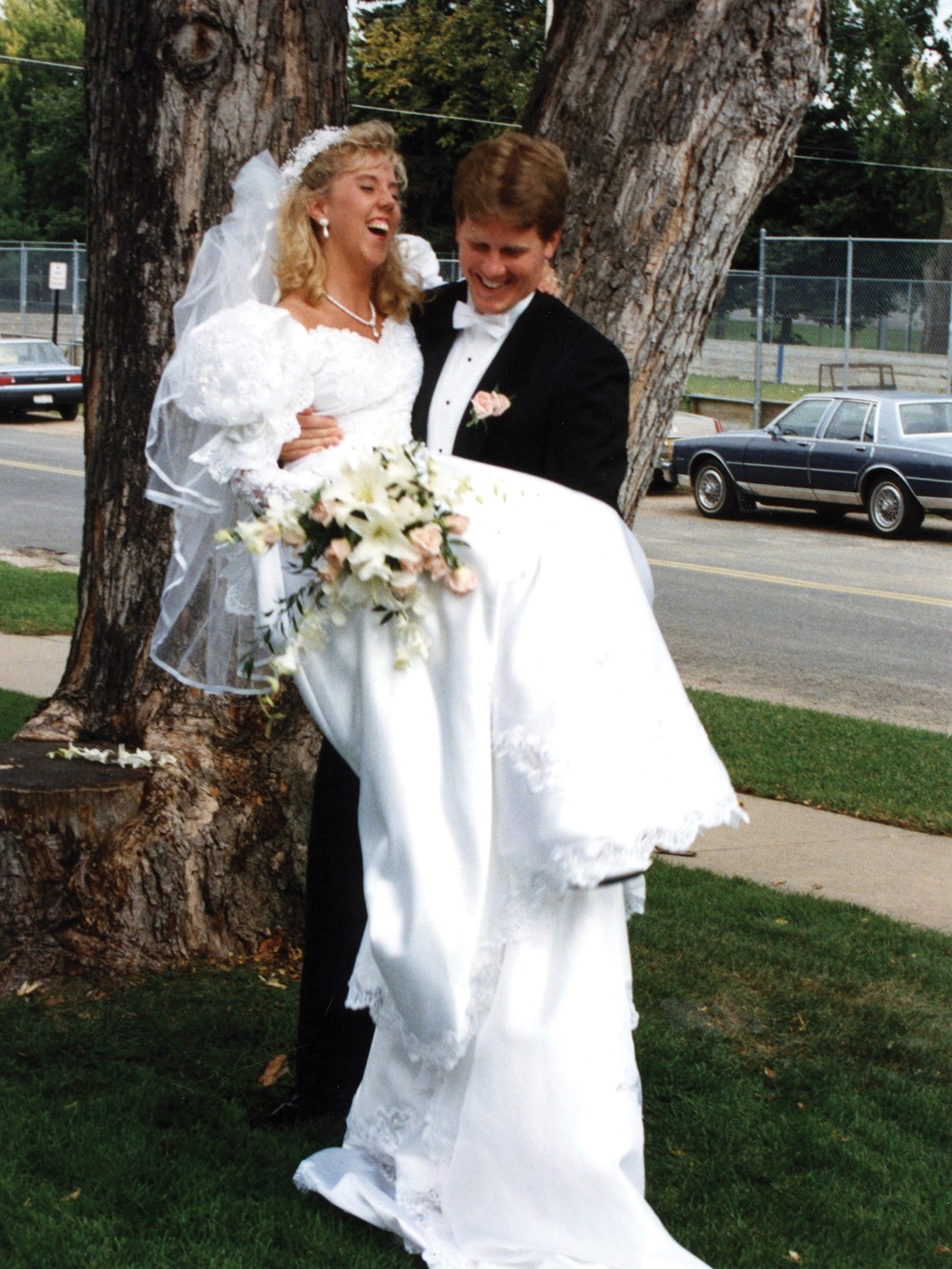 Paige Mead’s parents, Evan and Sandy (neé Gibson) Anderson, on their wedding day on September 12, 1992. Sandy’s gown was purchased at The Wedding Shoppe on St. Paul’s Grand Avenue, which is where Paige also purchased her wedding dress.