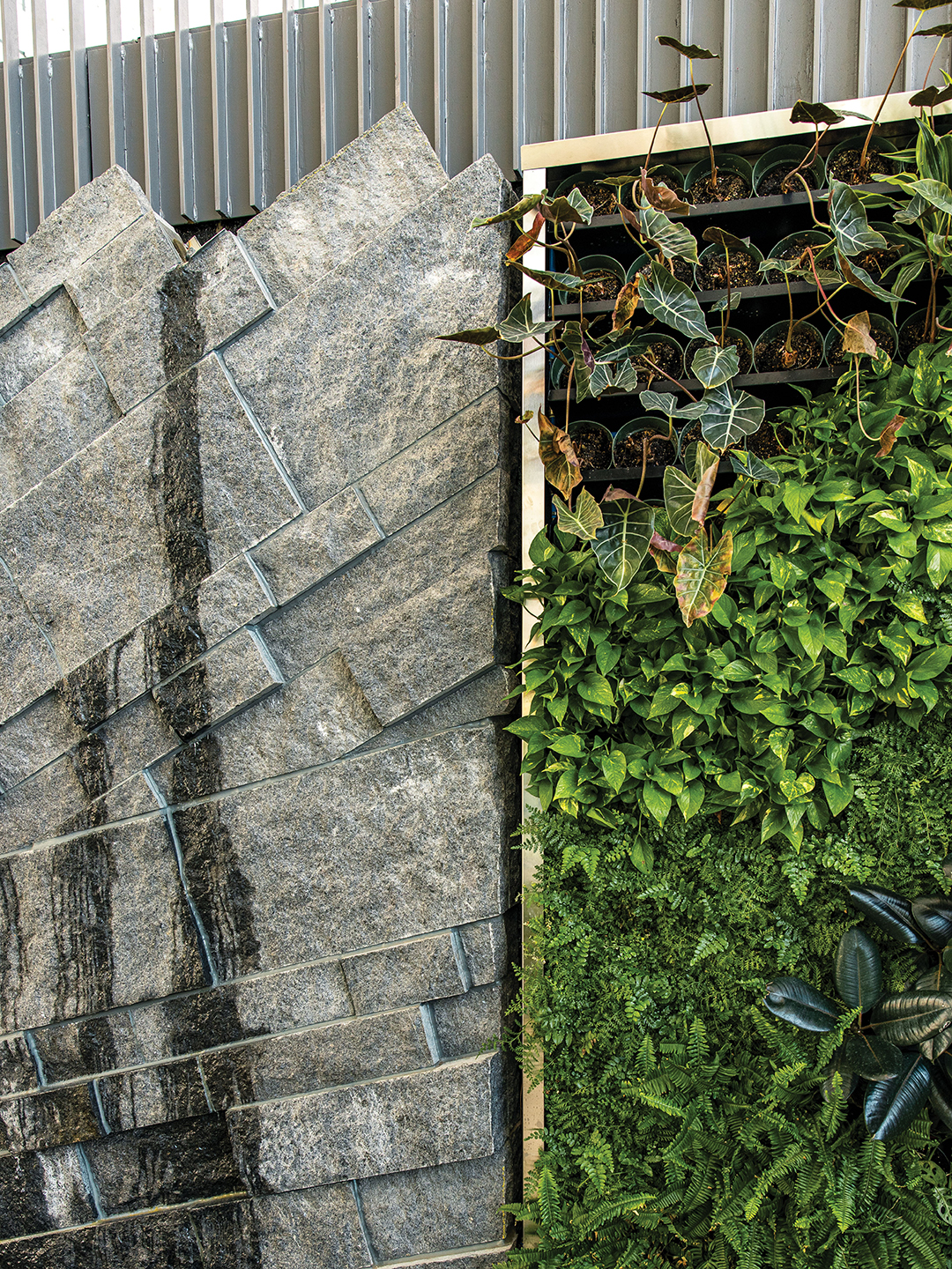 The slate waterwall modernizes one of Central Park’s treasured elements, and it is surrounded by hundreds of plants.