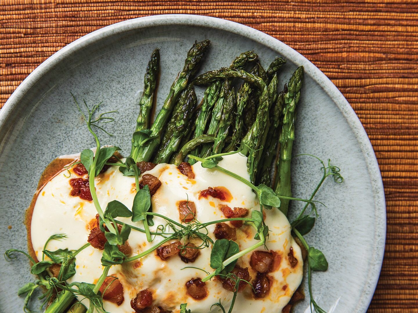 Asparagus with pancetta, Gruyére fonduta, lemon and herb oil.