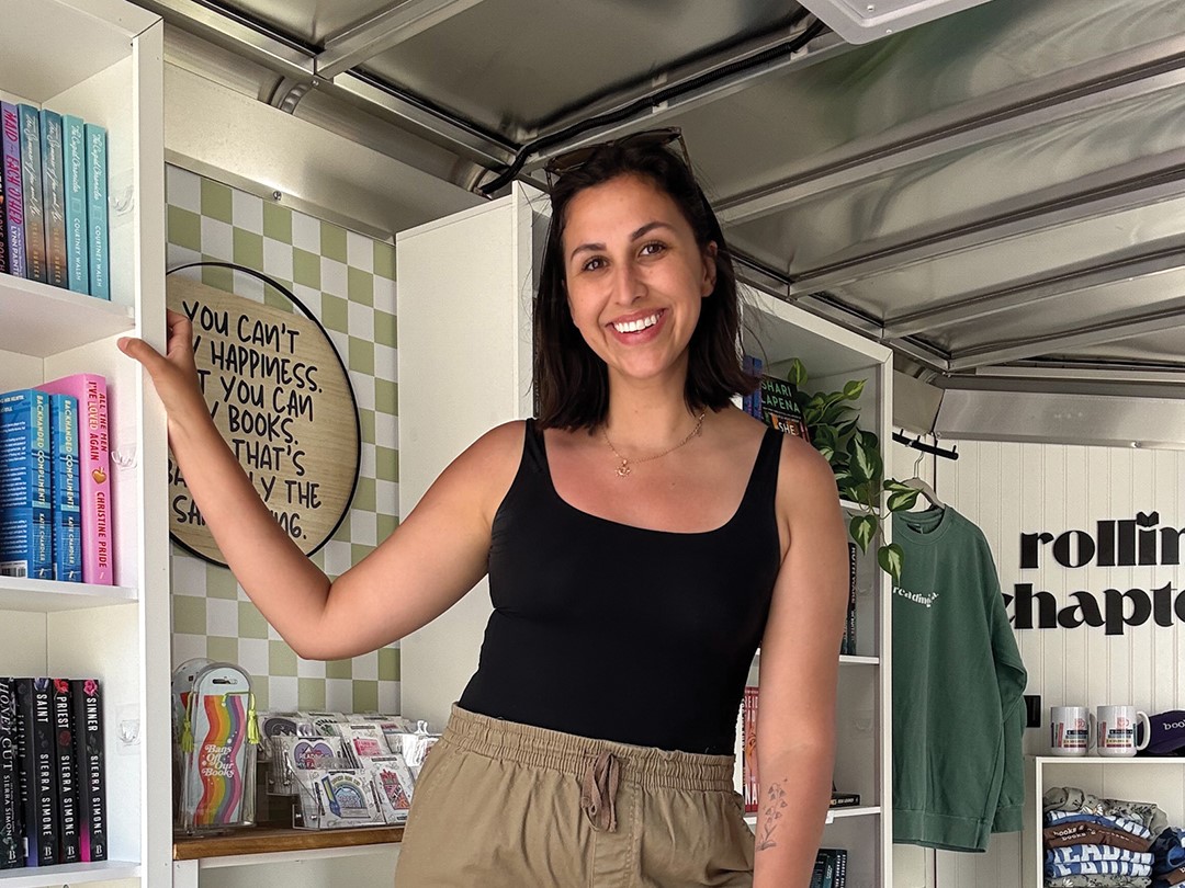 Danielle Weber inside the Rolling Chapters mobile bookshop