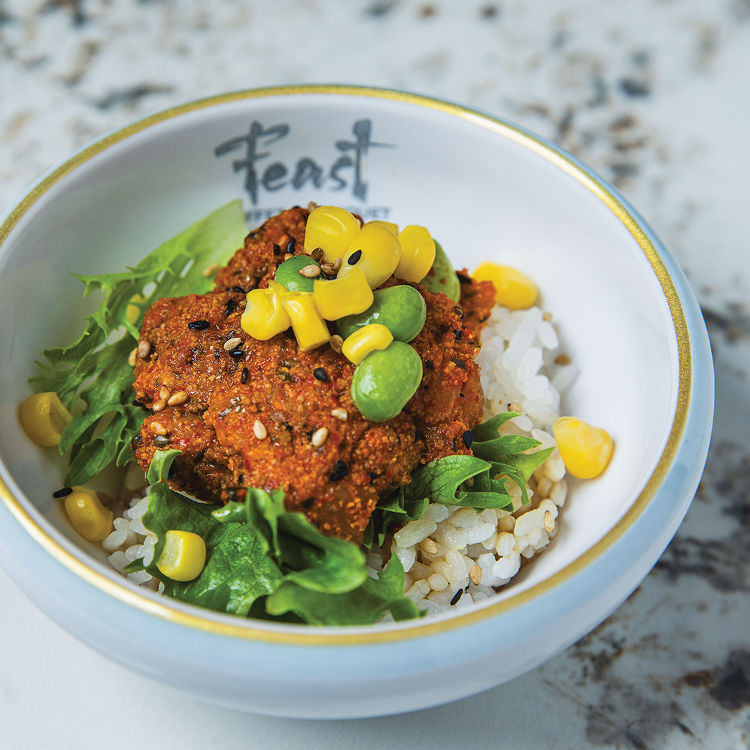 The Salmon Poke Bowl layers crisp textures with fresh ingredients, creating a delightful balance of flavors.