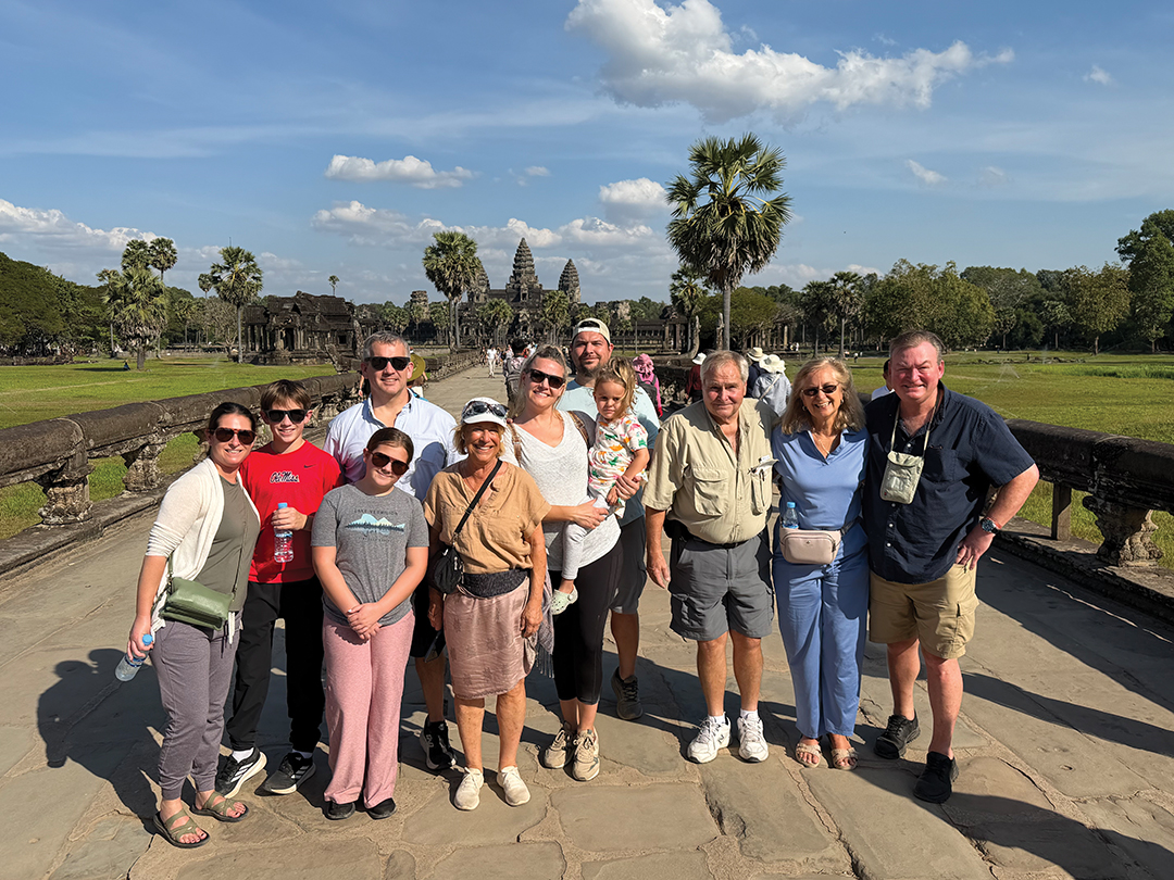 Lee Faulkner, co-founder of Meadowbrook Travel, has taken multigenerational travel to the international level, as seen here on their family vacation to the Angkor Wat Theraveda Buddhist temple in Siem Reap, Cambodia.