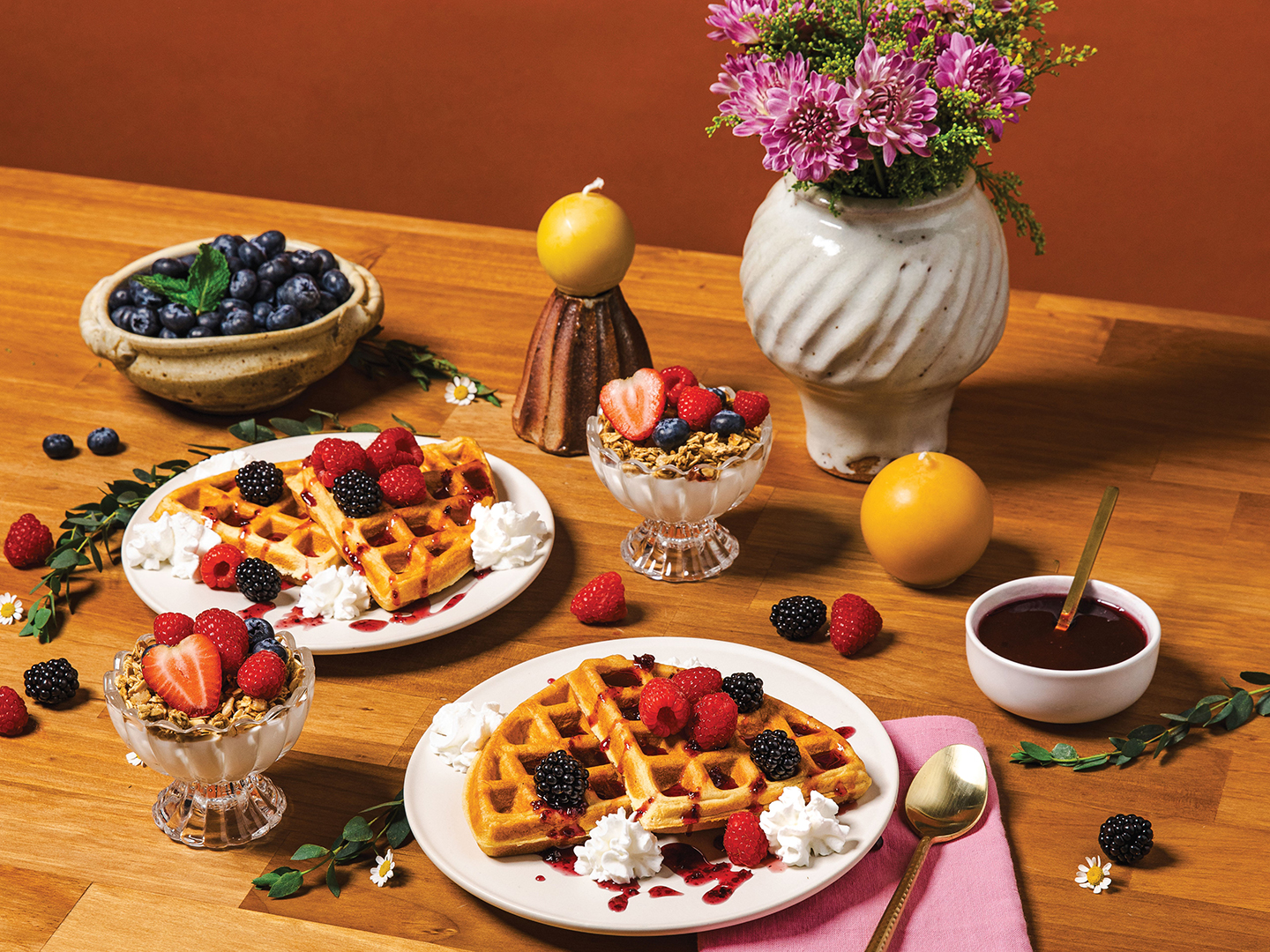 Breakfast tablescape with fresh berries, waffles and flowers