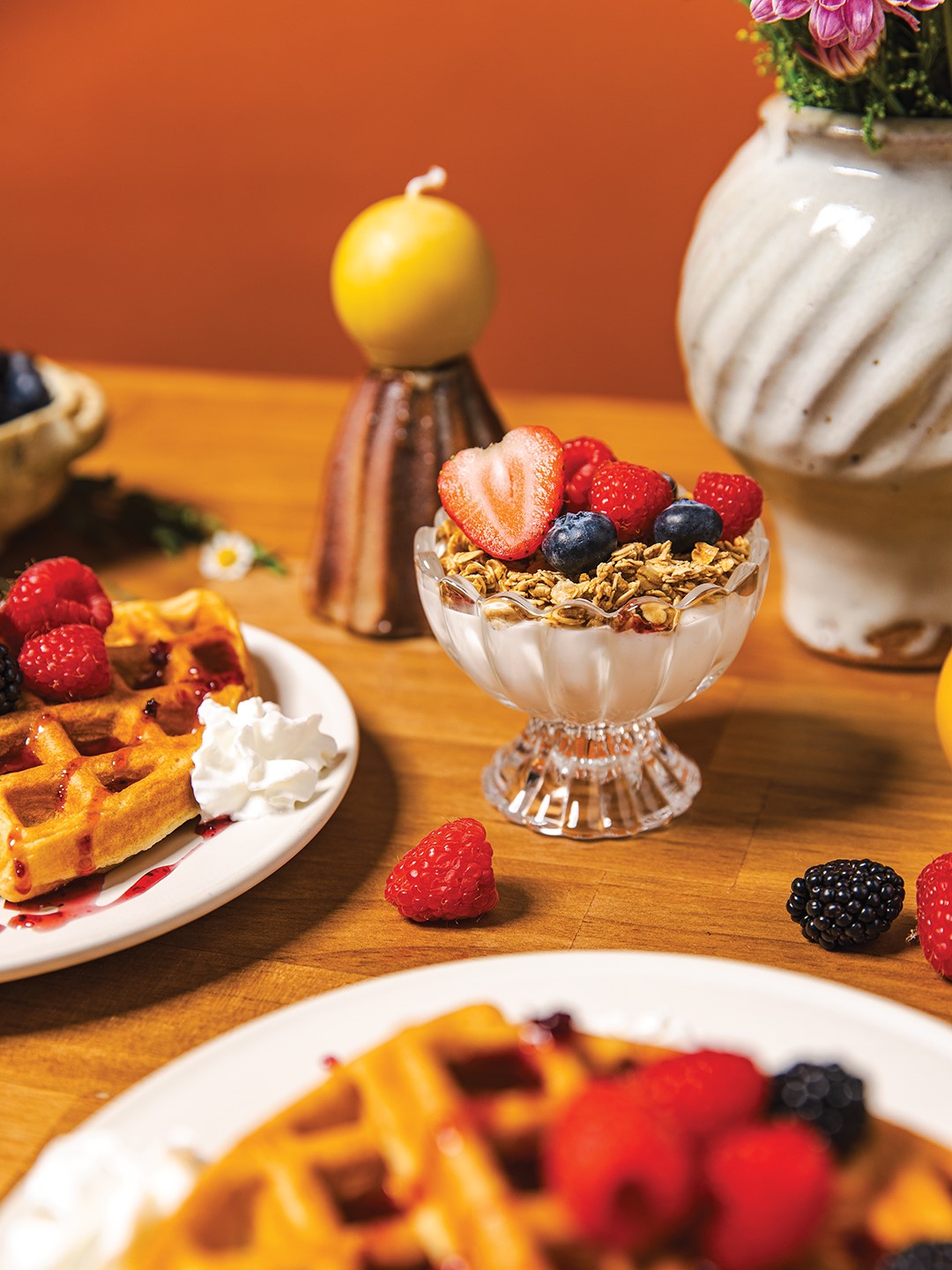 There’s nothing better than a breakfast spread featuring berries—consider a berry parfait or berry-topped waffles. Vase by Olivia Jenson, oliviajenson.com; Candle by Hilltop Handmade Goods, @hilltopgoodsmn