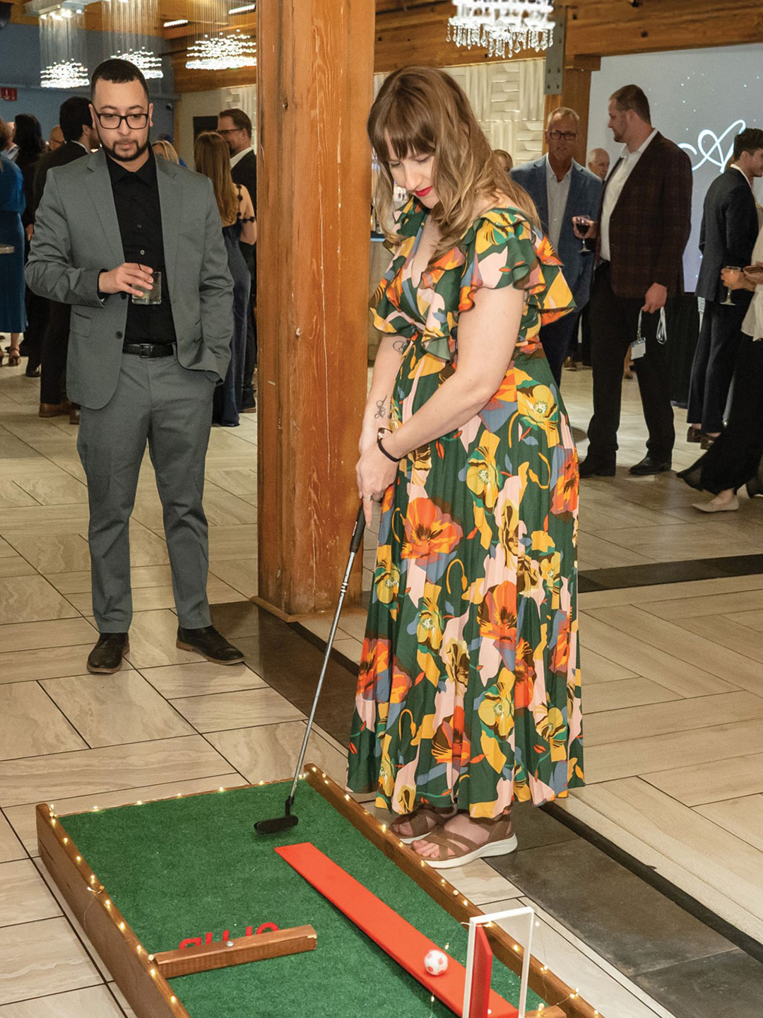 The Backyard Birdies’ portable mini golf hole makes an evening gala all the more entertaining.