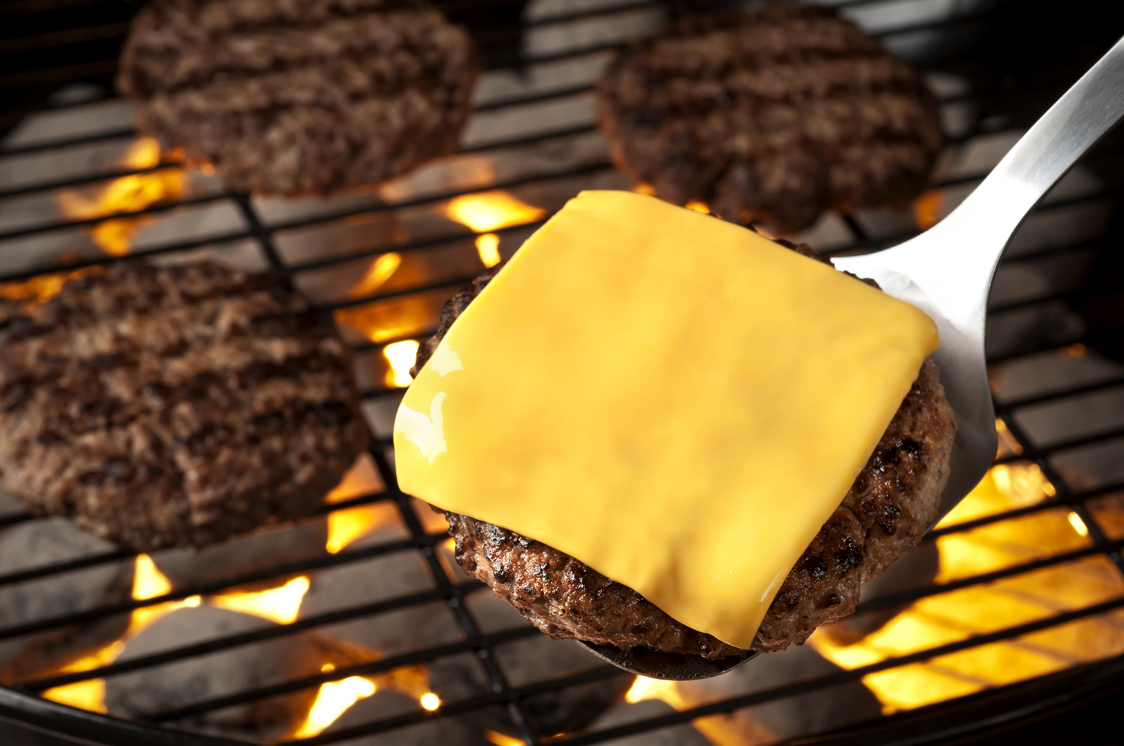 Grilled burgers on the grill.