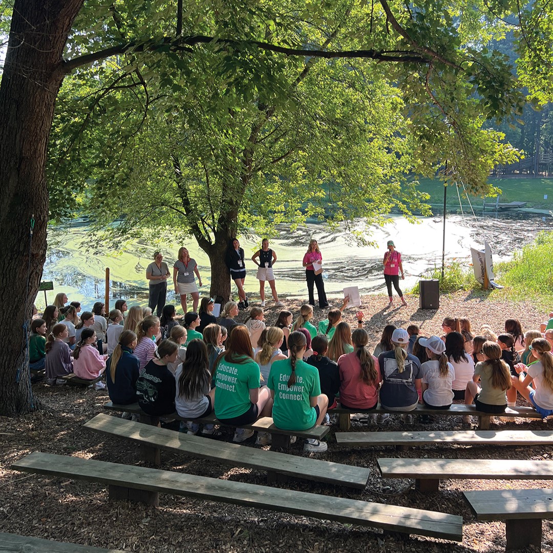 The group gathers for a flag ceremony at the You R You retreat in 2025.