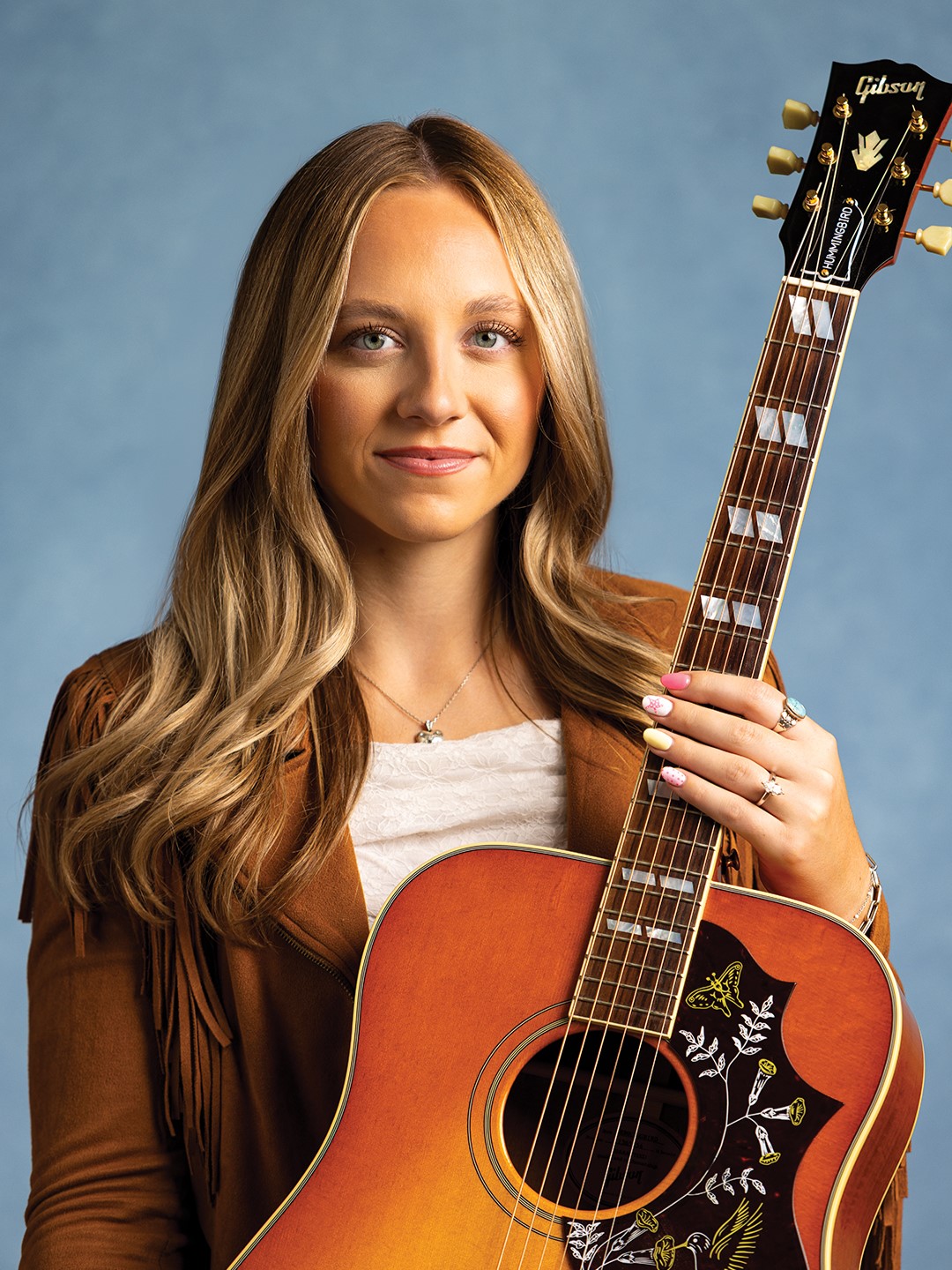 The TV show America’s Got Talent, which Hailey James and her father, AJ Trzebiatowski, watched together, inspired Hailey to pick up the guitar. She was only in eighth grade.
