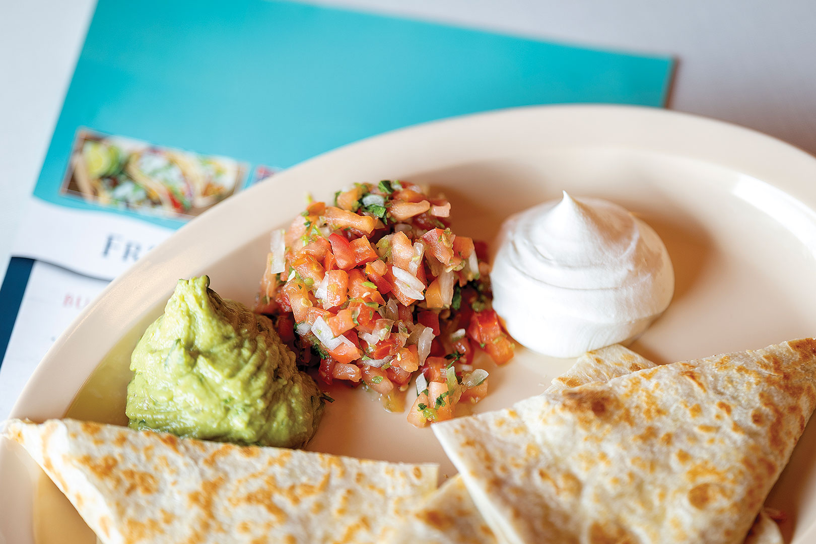 The Quesadilla is created with the customer’s choice of meat and served alongside guacamole, sour cream and pico de gallo.